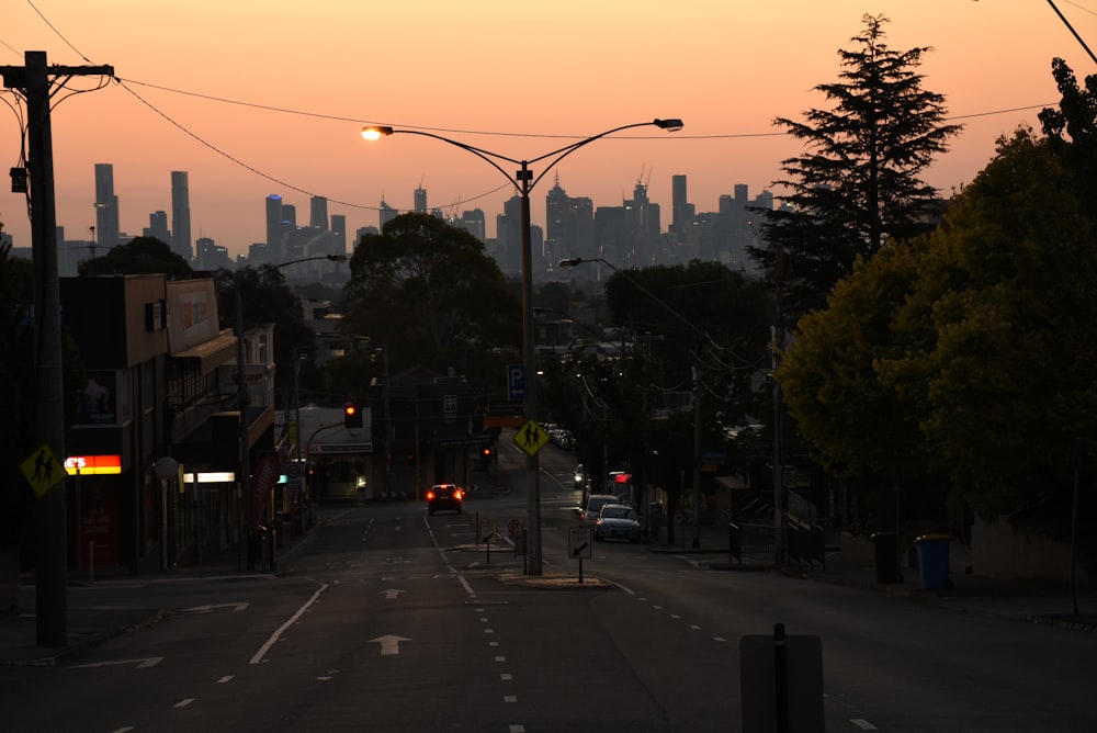 a street with cars on it and buildings in the back