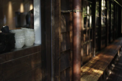 Stack of durable stoneware plates with earthy tones set on linen cloth for a cozy meal.