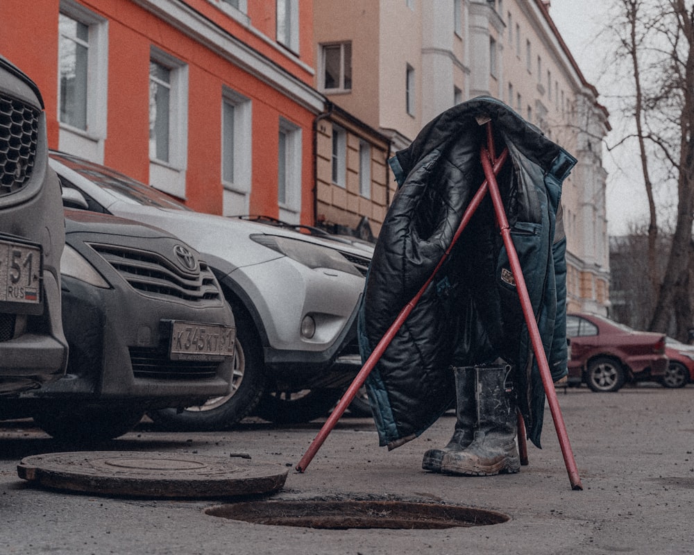 a person in a garment next to a car