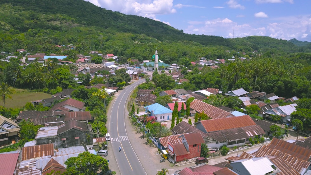 a road with buildings and trees on the side