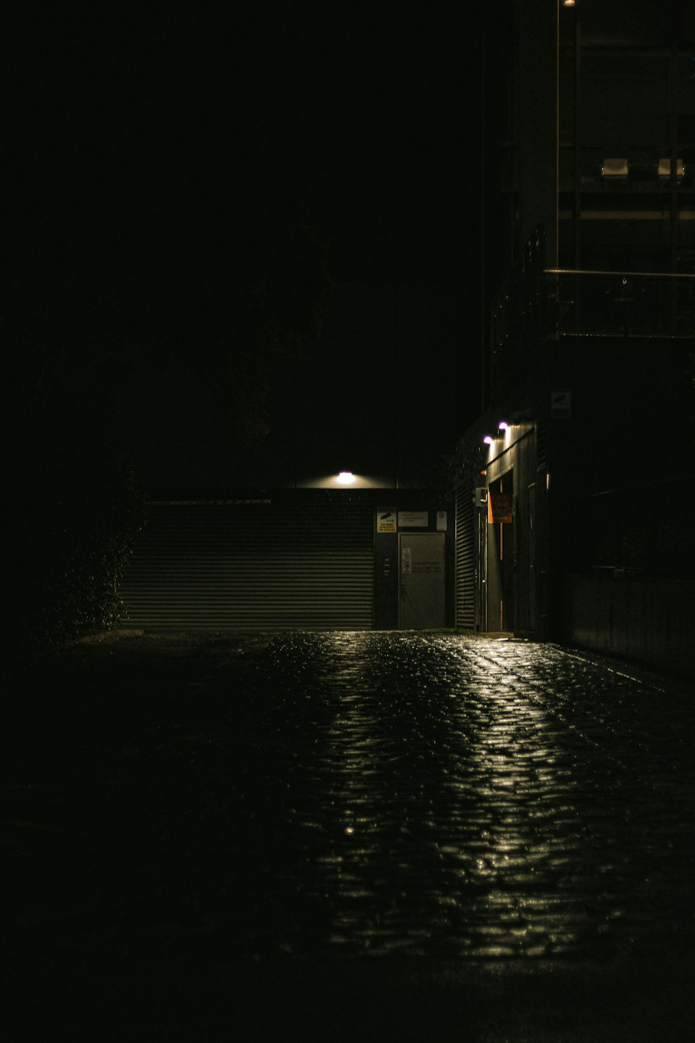 a body of water with buildings along it at night