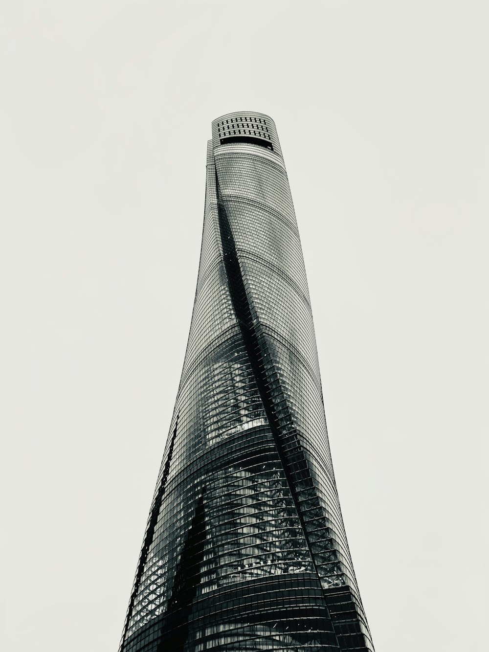 a tall building with a curved top