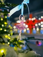 Decorated glass ball featuring delicate dot painting in soft pastel colors.
