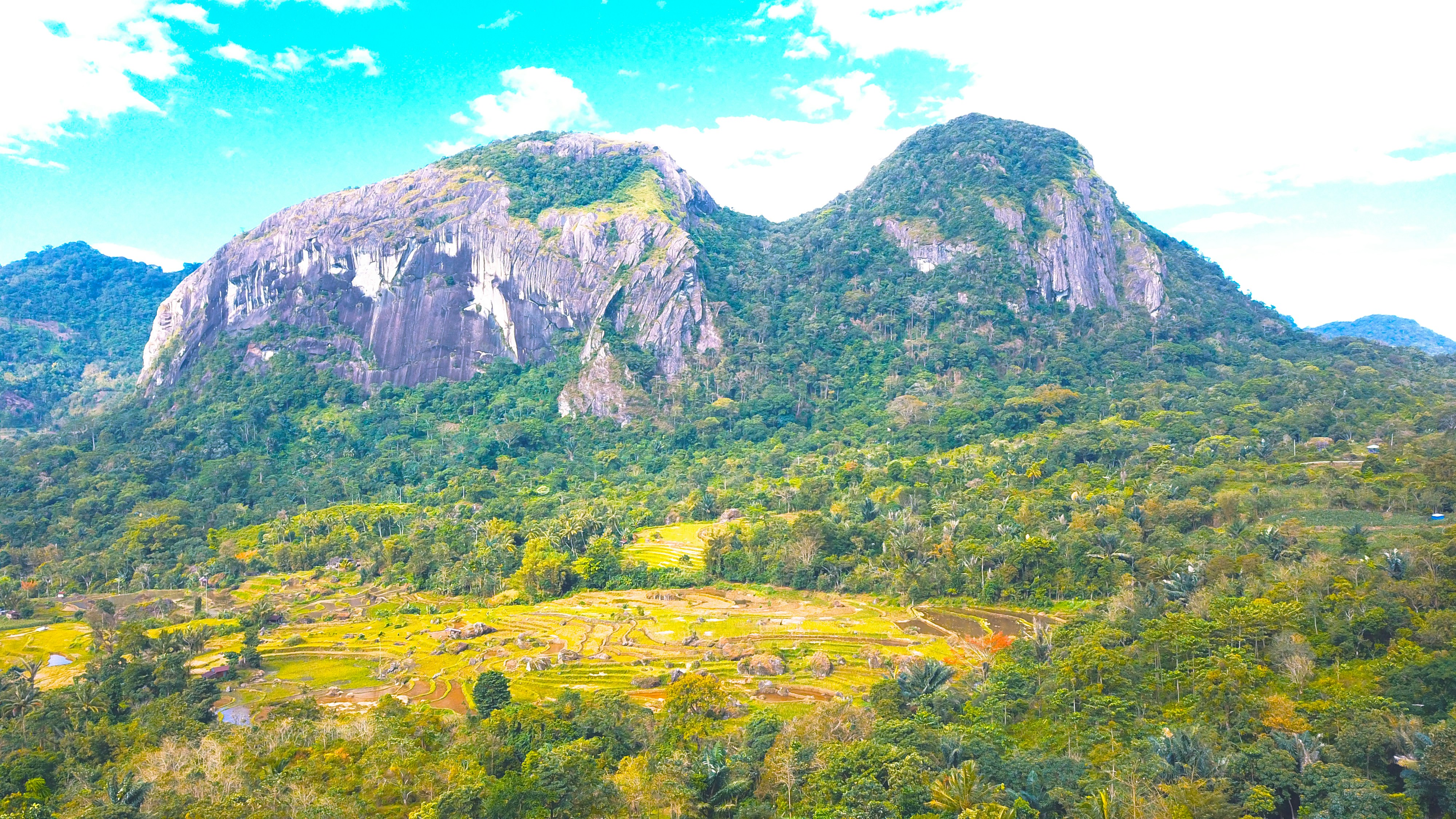 a landscape with mountains and trees, Bulu Dua is one of the icons or markers when entering Soppeng Regency from the south (via the Makassar-Barru-Soppeng axis).