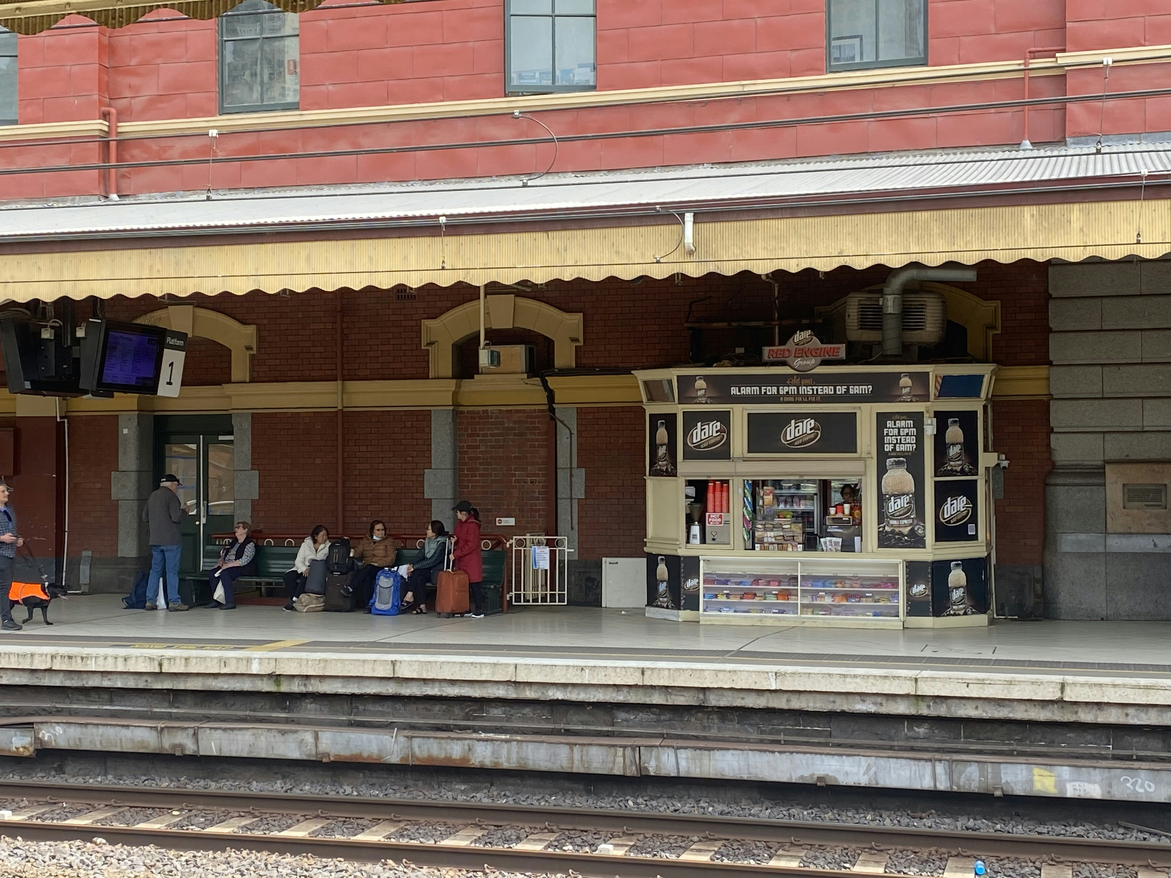 People waiting at a heritage station platform