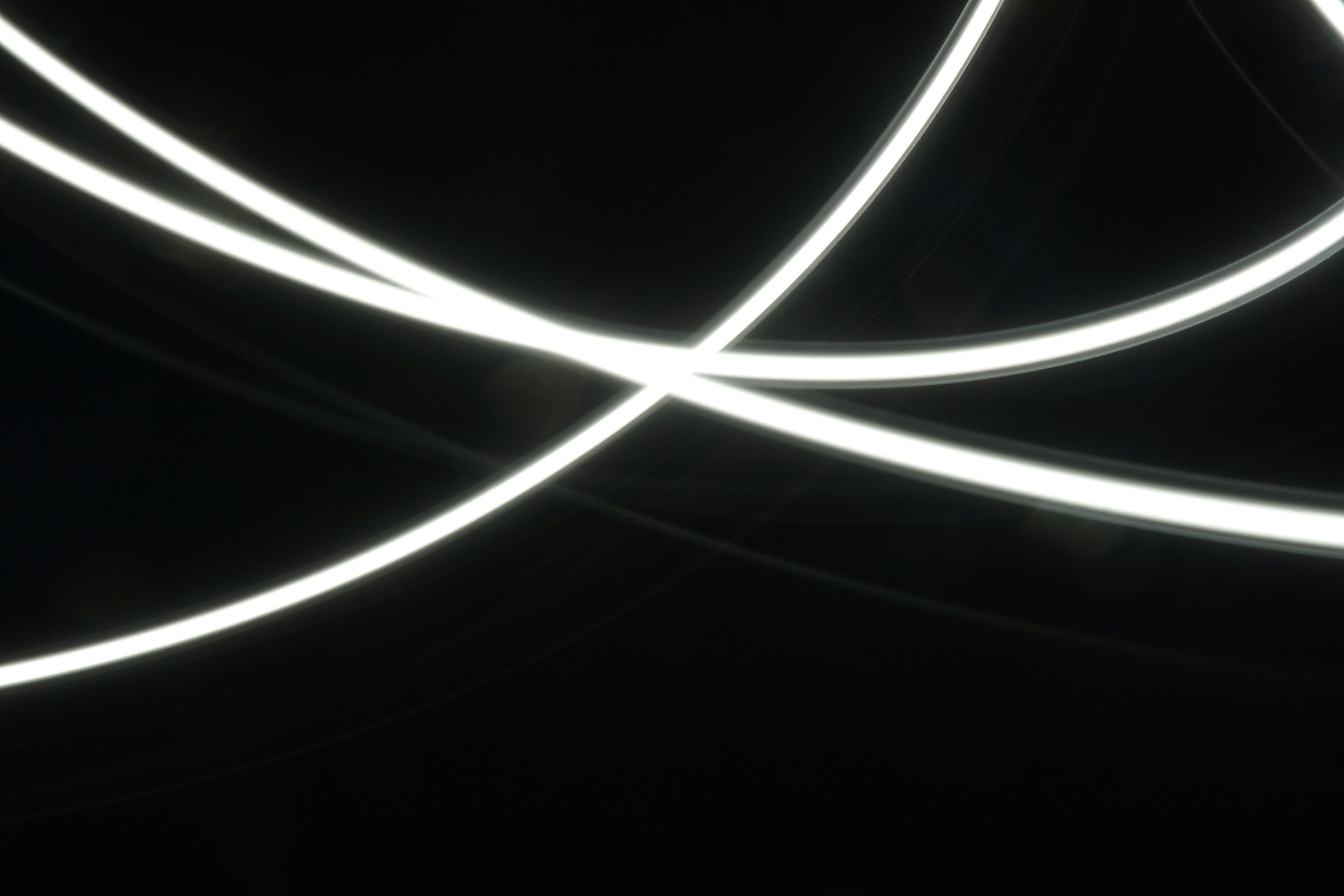 An abstract image of glowing nodes connected by thin lines of light on a dark background, representing the neural network of connected concepts in search.