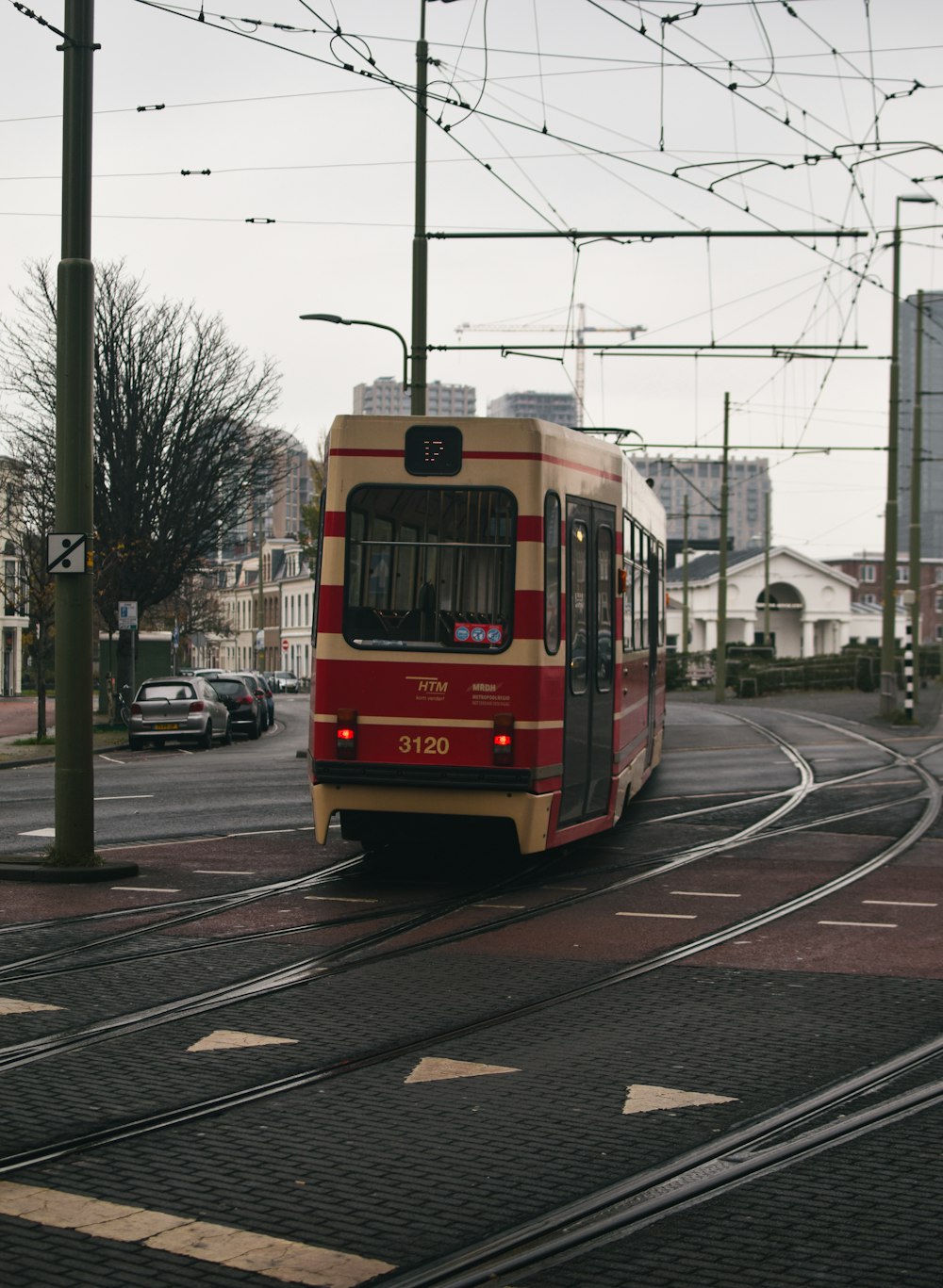 a red trolley on a street