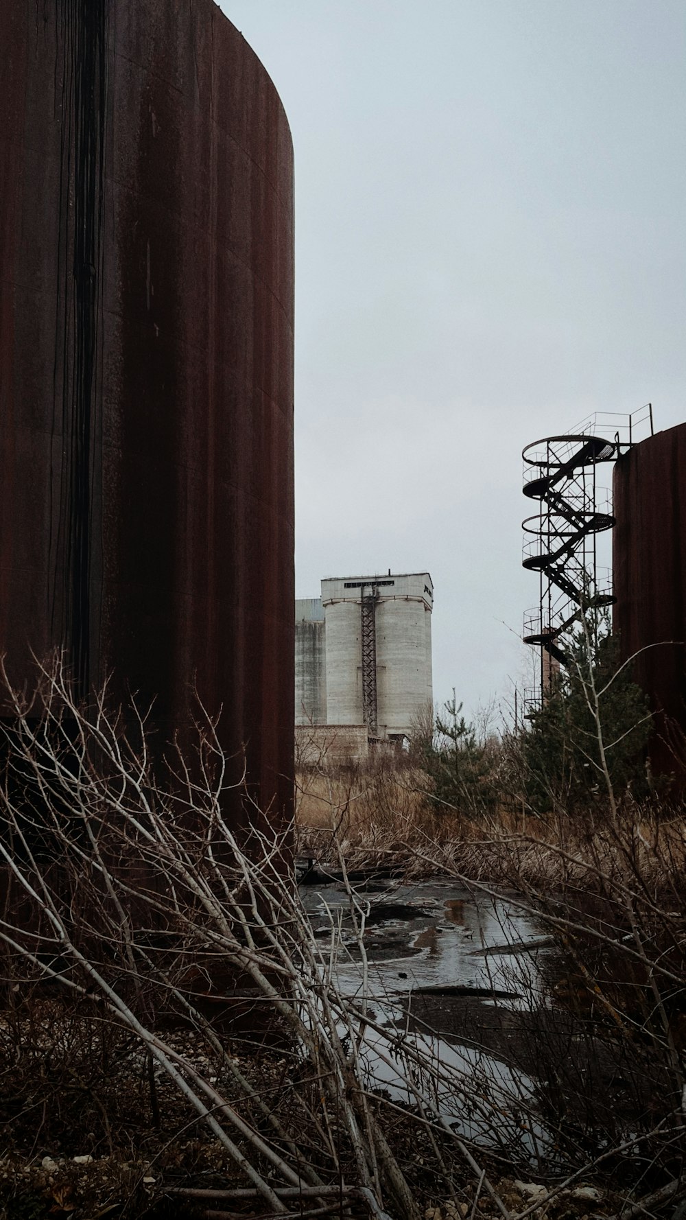 a water tower next to a river