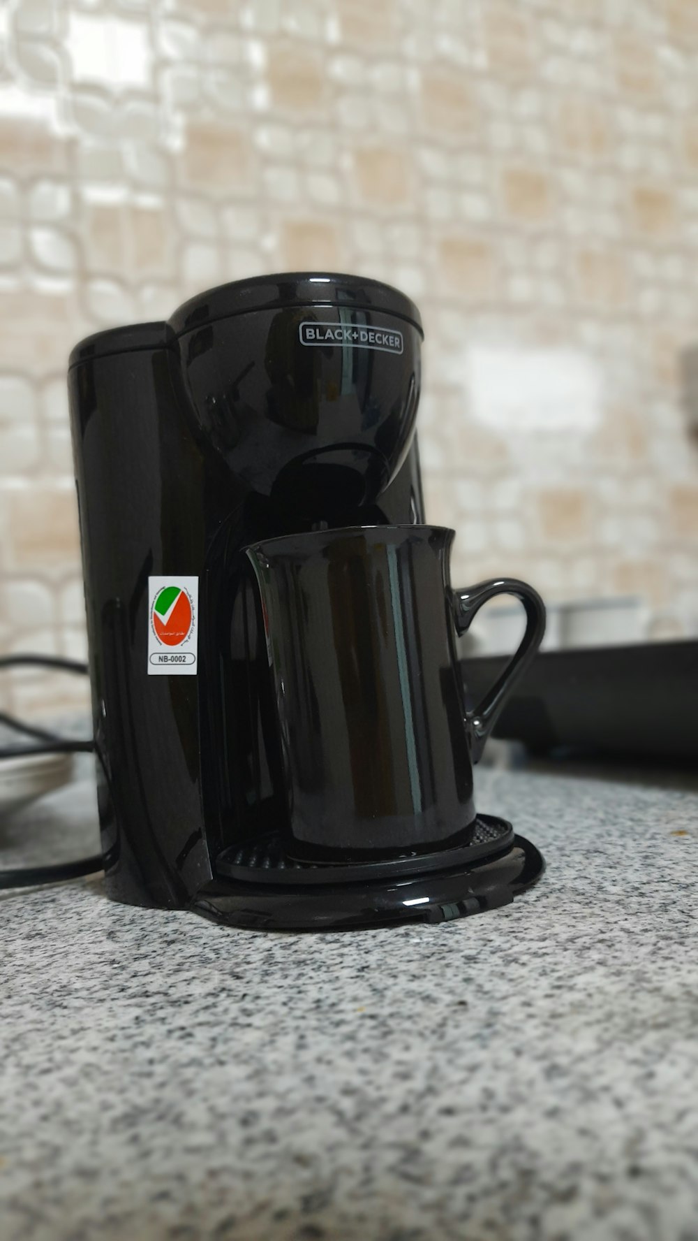 a black coffee maker