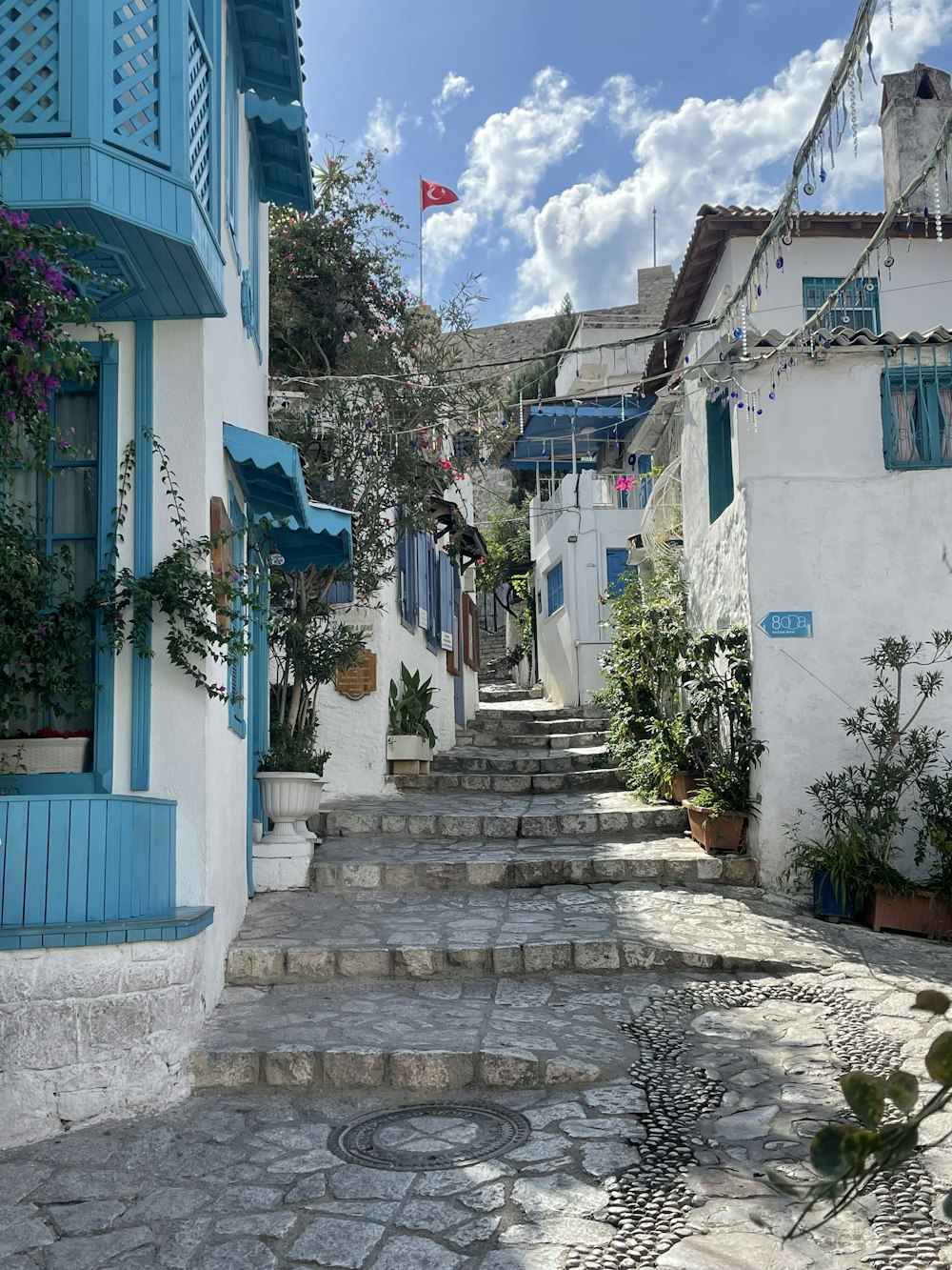 a stone street with buildings on both sides