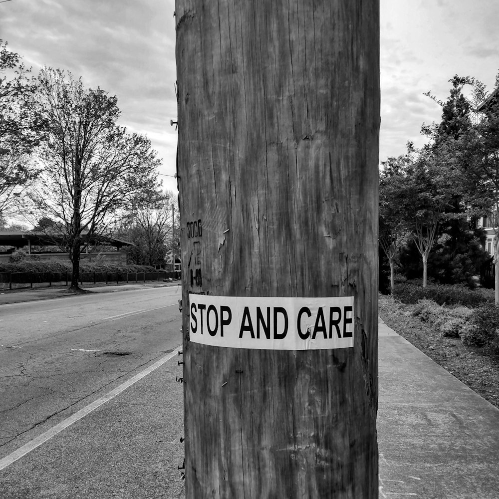 a sign on a wooden post