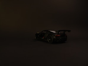 Minimalistic luxury BMW M2 G87 racing car silhouette against a dark, elegant background.