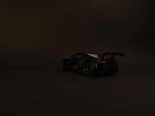Dark background image featuring a sleek car with indoor and outdoor 360 video highlights.