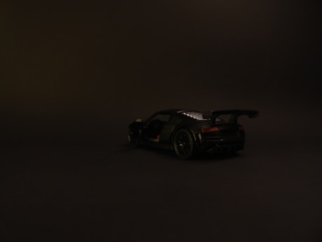 Dark background image featuring a sleek car with indoor and outdoor 360 video highlights.