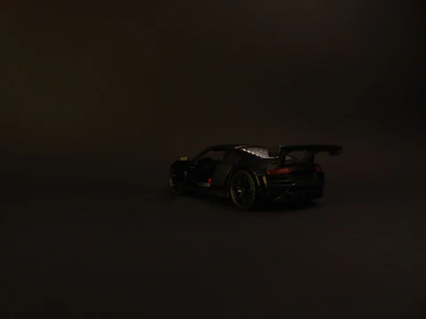 Dynamic commercial shoot featuring a sleek product against a minimalist dark backdrop.