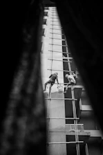 a few men working on a building