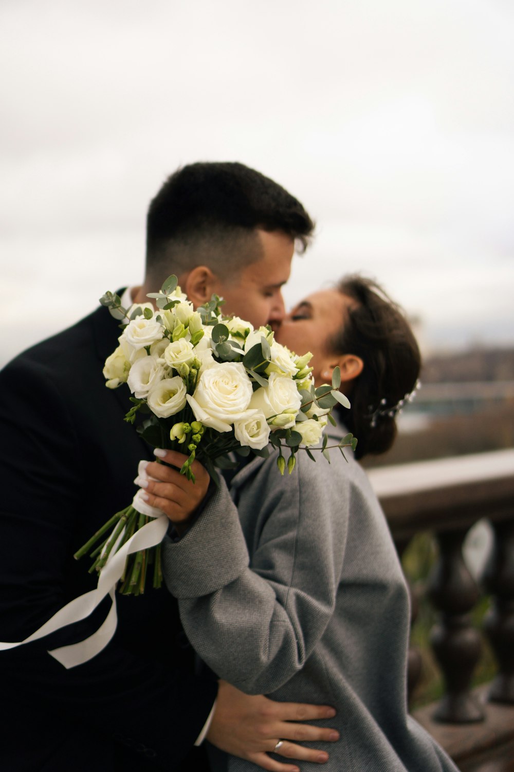 a man and woman kissing