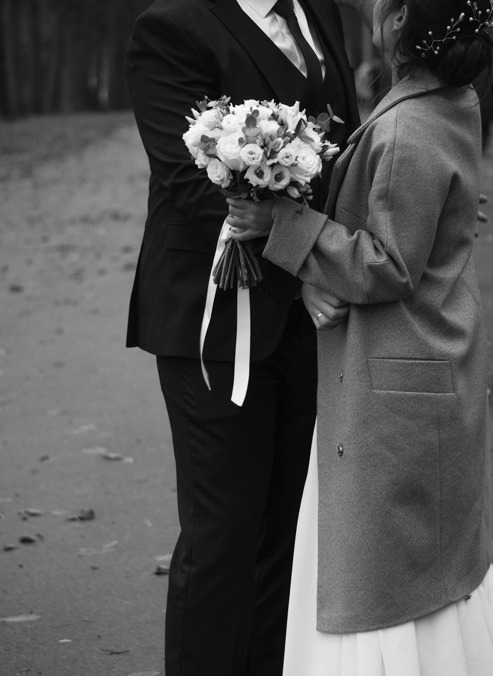 a man and woman holding flowers