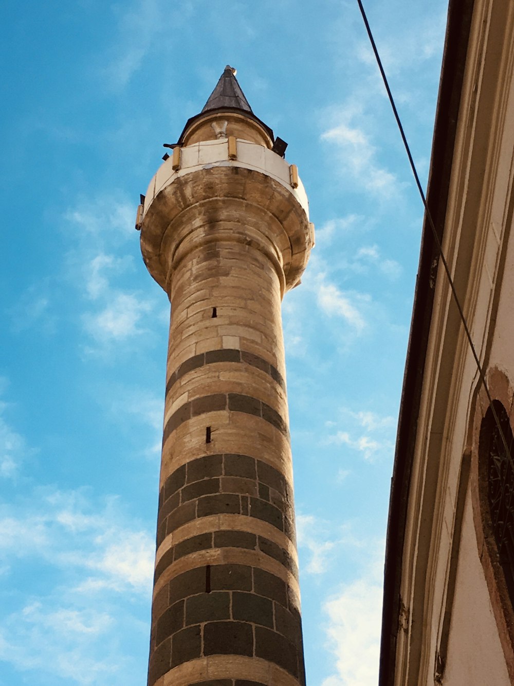 a tall tower with a circular top