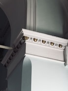 Close-up of premium architectural detail in navy blue and emerald tones.