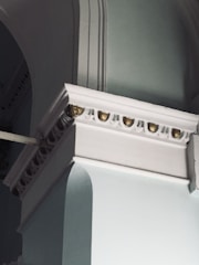 Premium architectural detail with navy and emerald color scheme.