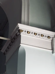 Modern architectural detail with champagne gold accents highlighting luxury design.