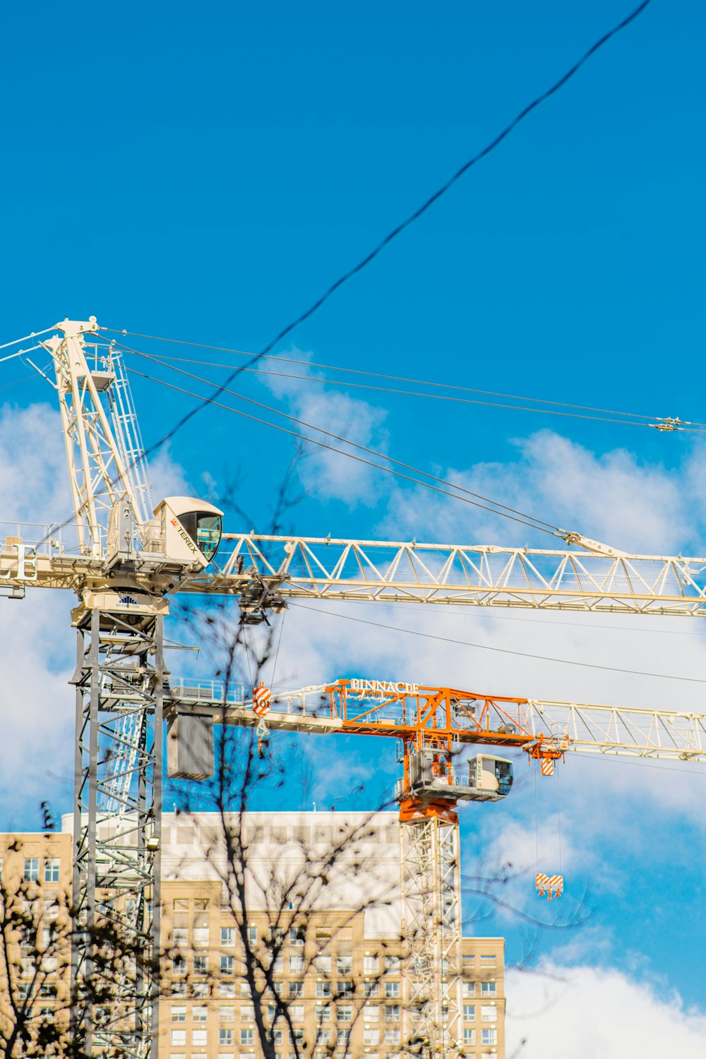 a crane next to a building