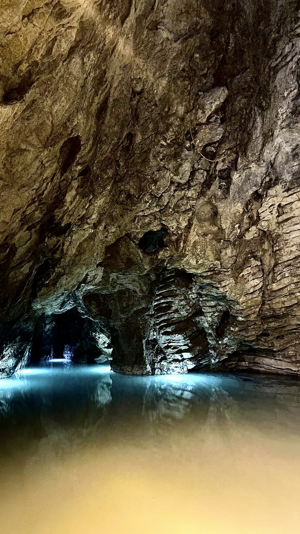 a cave with a body of water in it