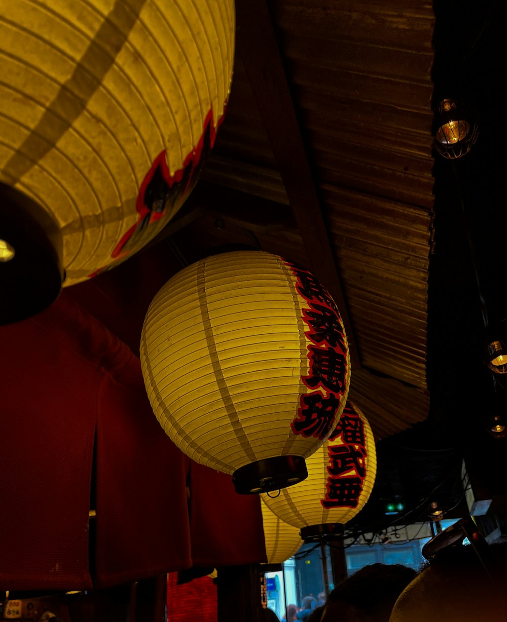 a group of lanterns from a ceiling