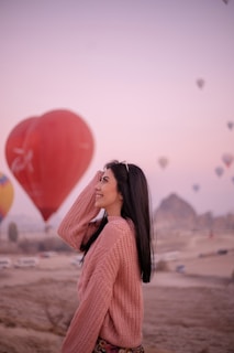 a person with a red balloon