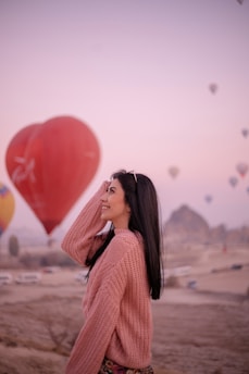 a person with a red balloon