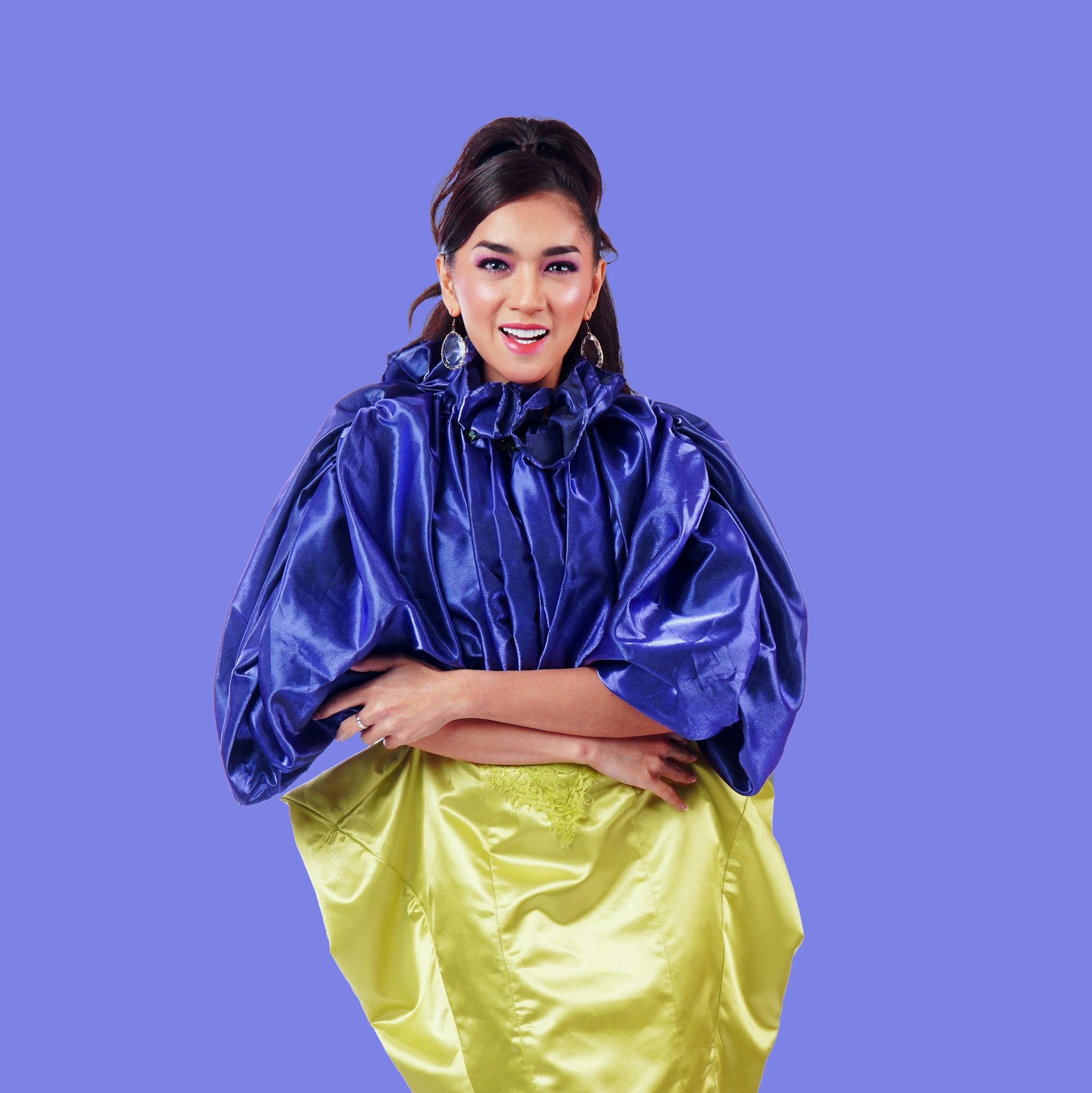 woman wearing yellow long-sleeved dress under white clouds and blue sky during daytime