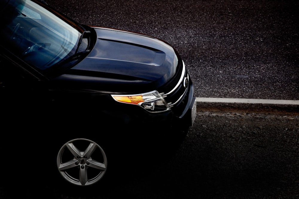 a black car parked on a street