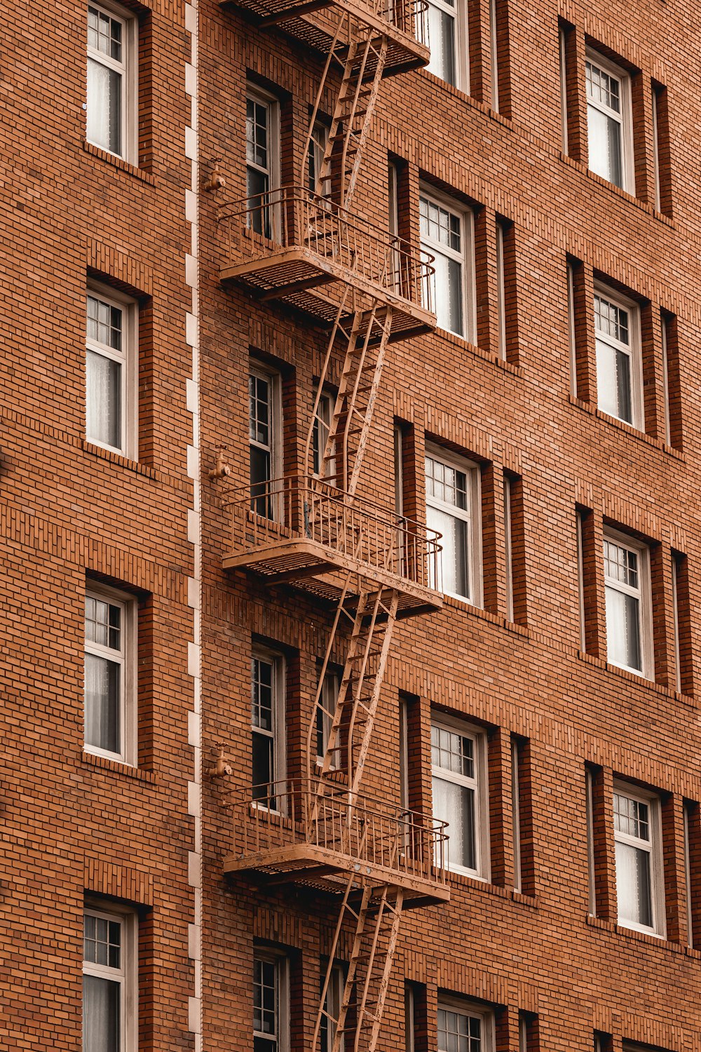 a building with windows and ladders