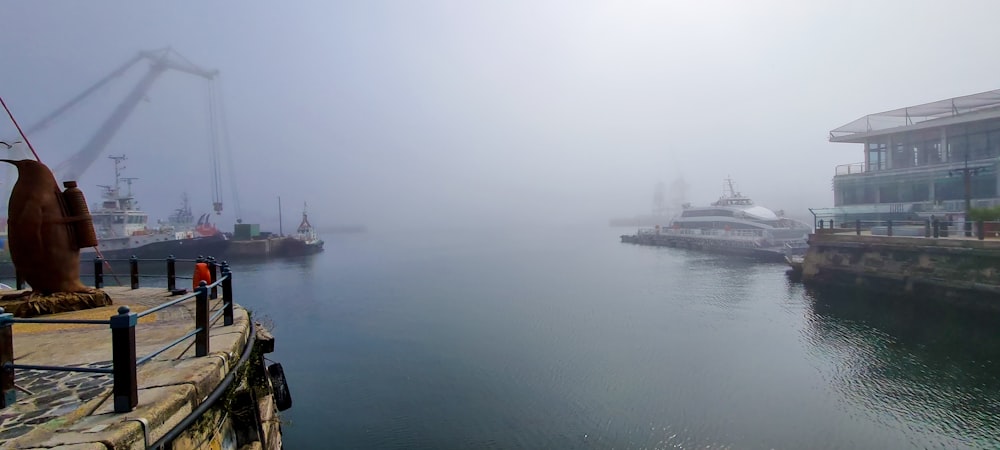 a body of water with boats in it and buildings around it