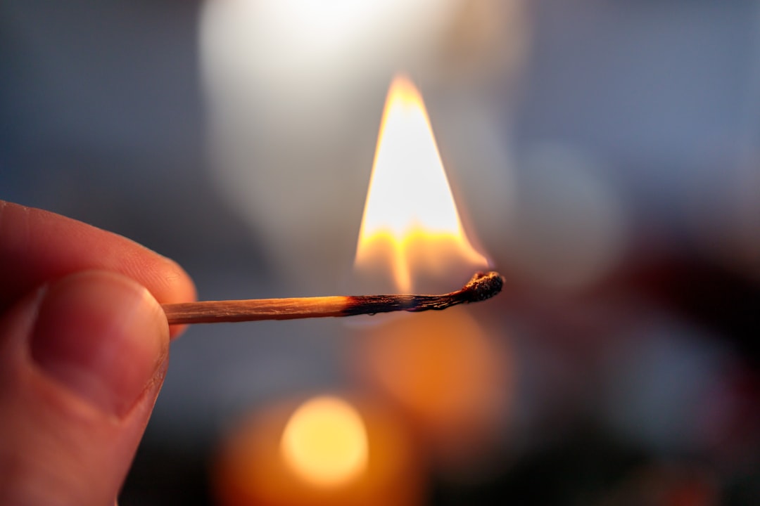 a hand holding a match, Burning Match in a Hand