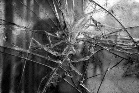 shattered window pieces that is hold on together by safety security film