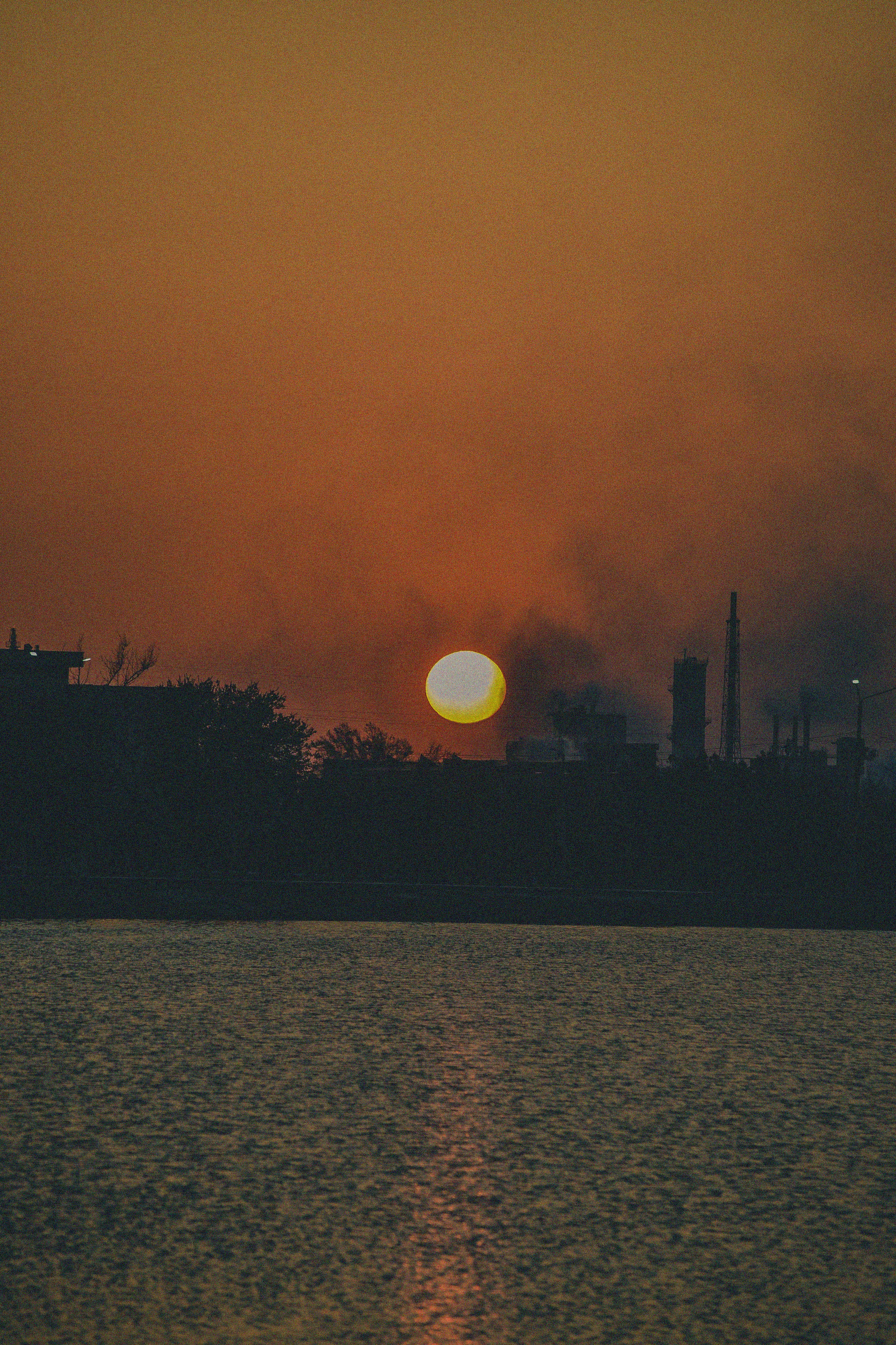 a sunset over a city