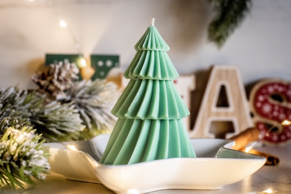 a green christmas tree on a plate