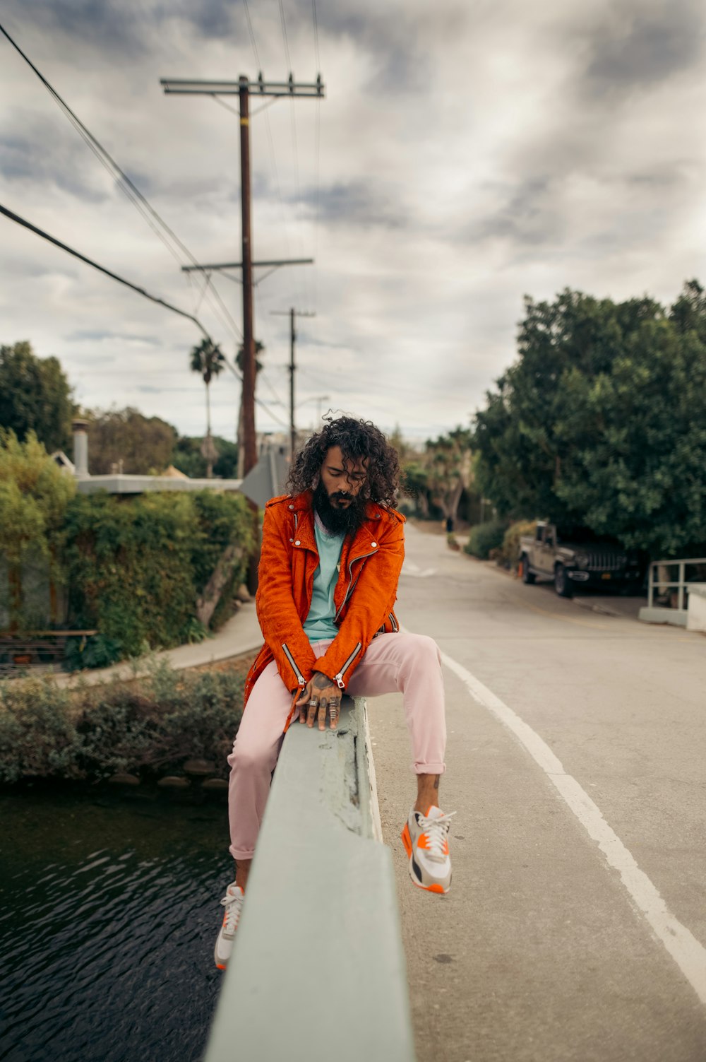 a person sitting on a concrete ledge