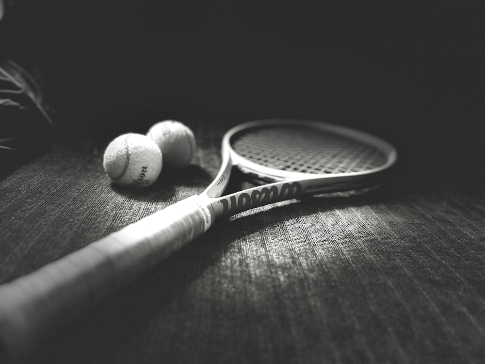a racket and balls on a table
