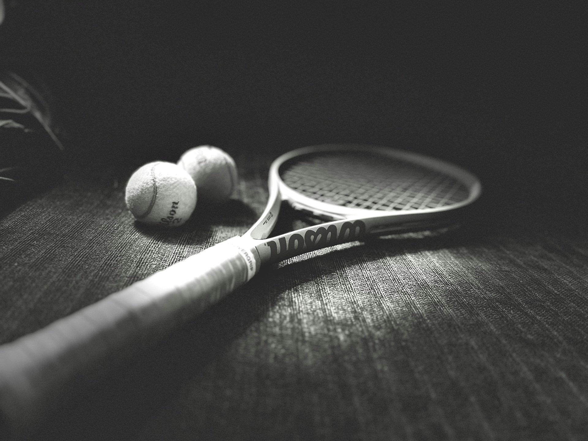 a racket and balls on a table