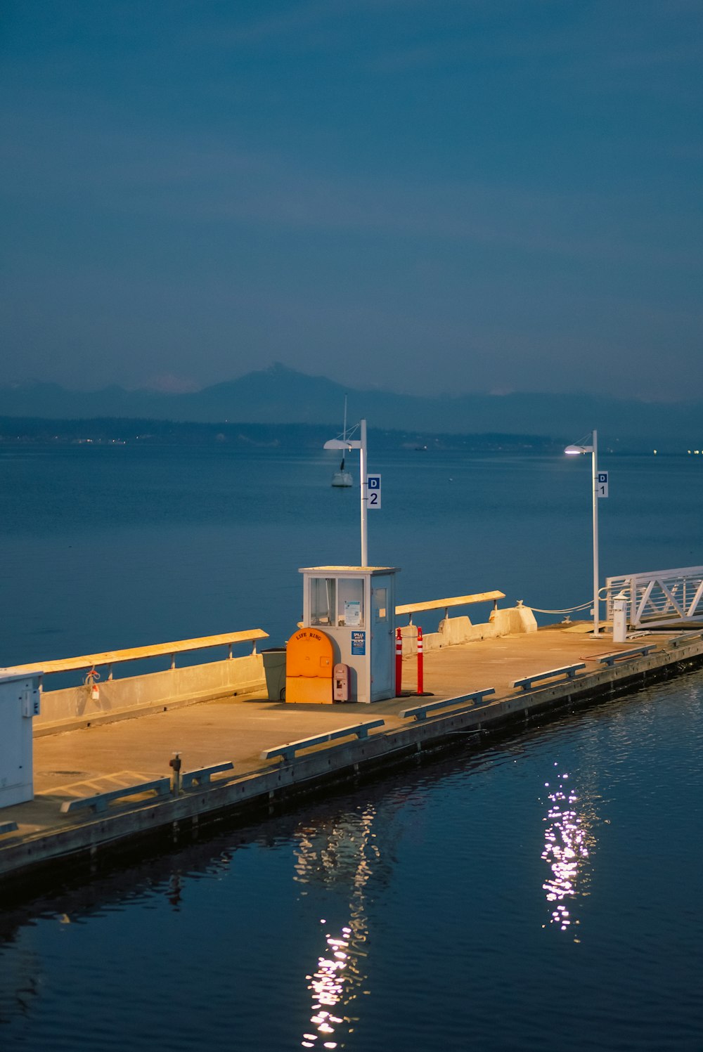 a dock with a small tower