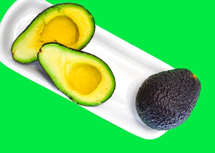 a cut avocado and a cut avocado on a plate