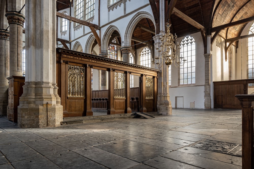 a large room with pillars and a large arched ceiling