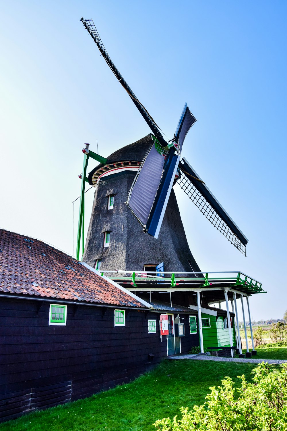 a windmill next to a building