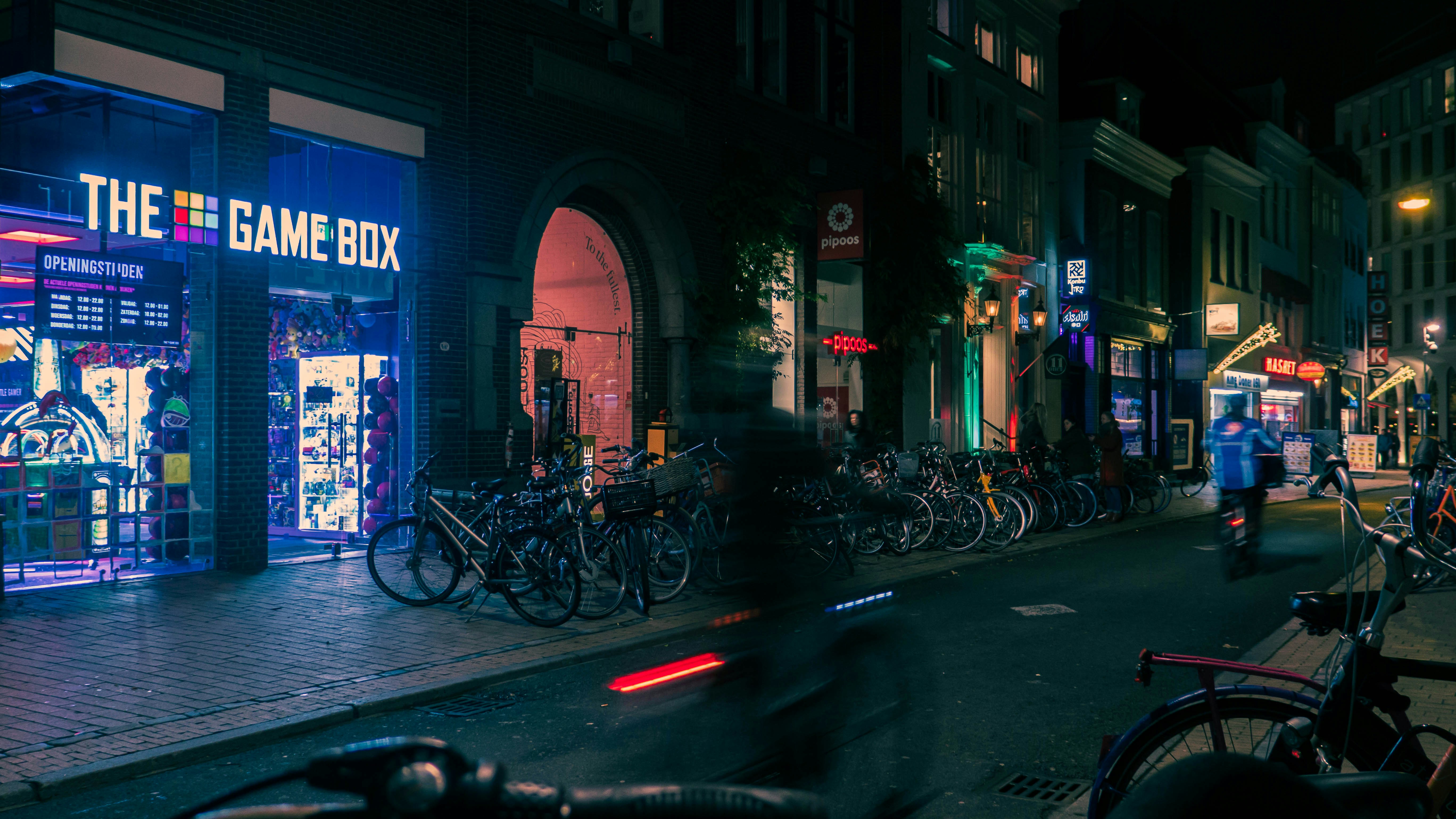 a city street with bikes parked on the side