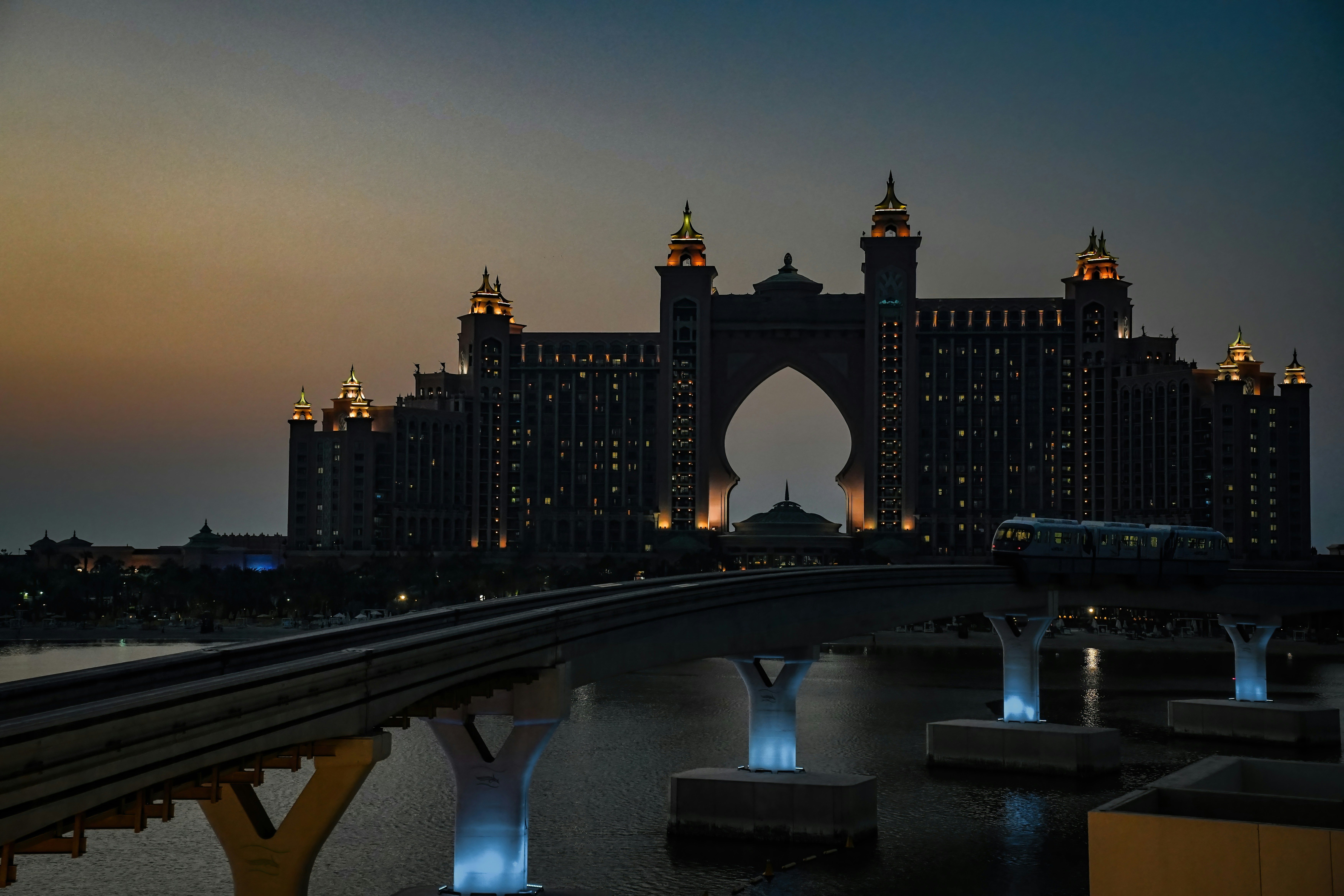 a city skyline with a bridge, 