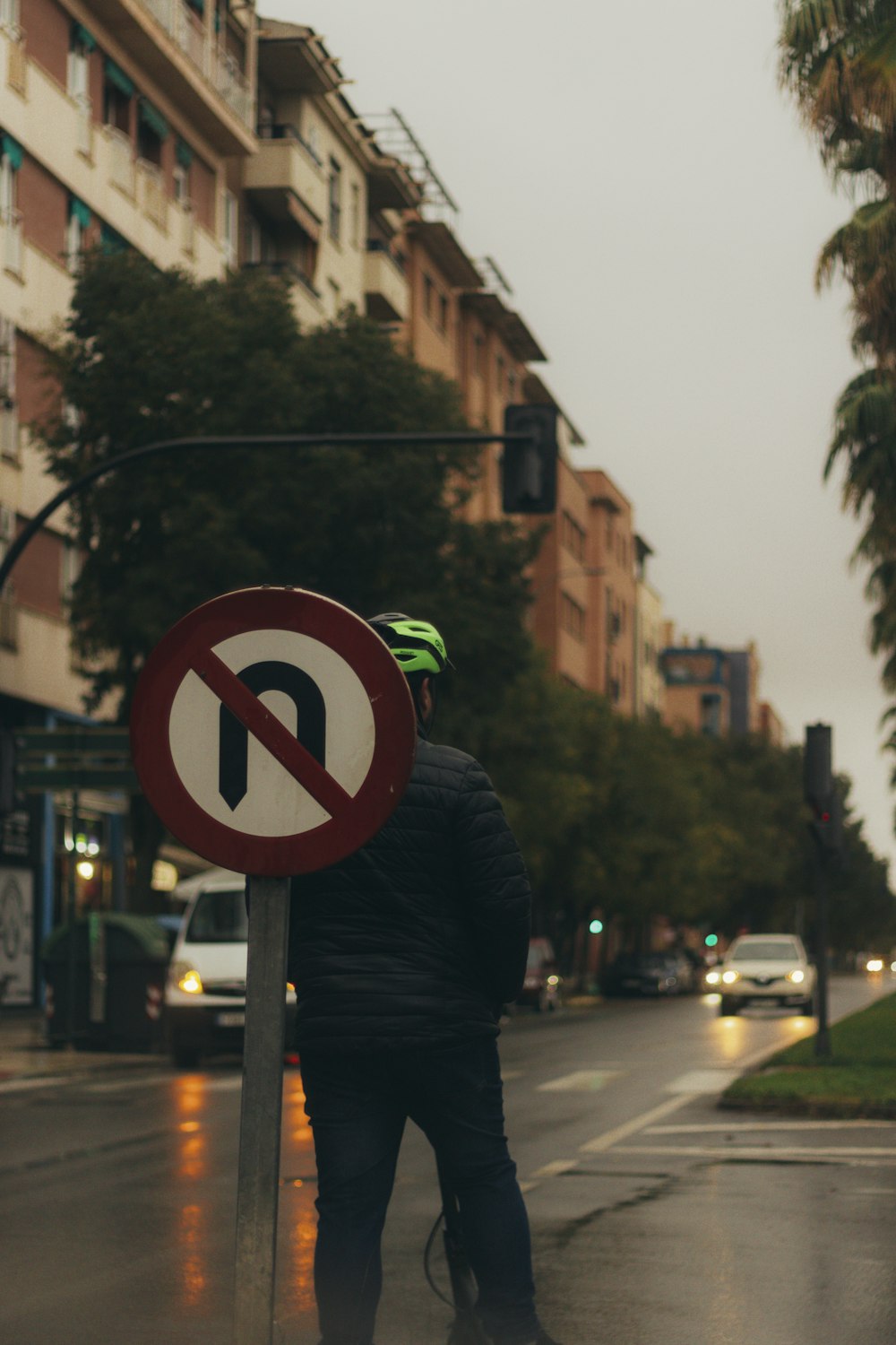 a person stands on the sidewalk