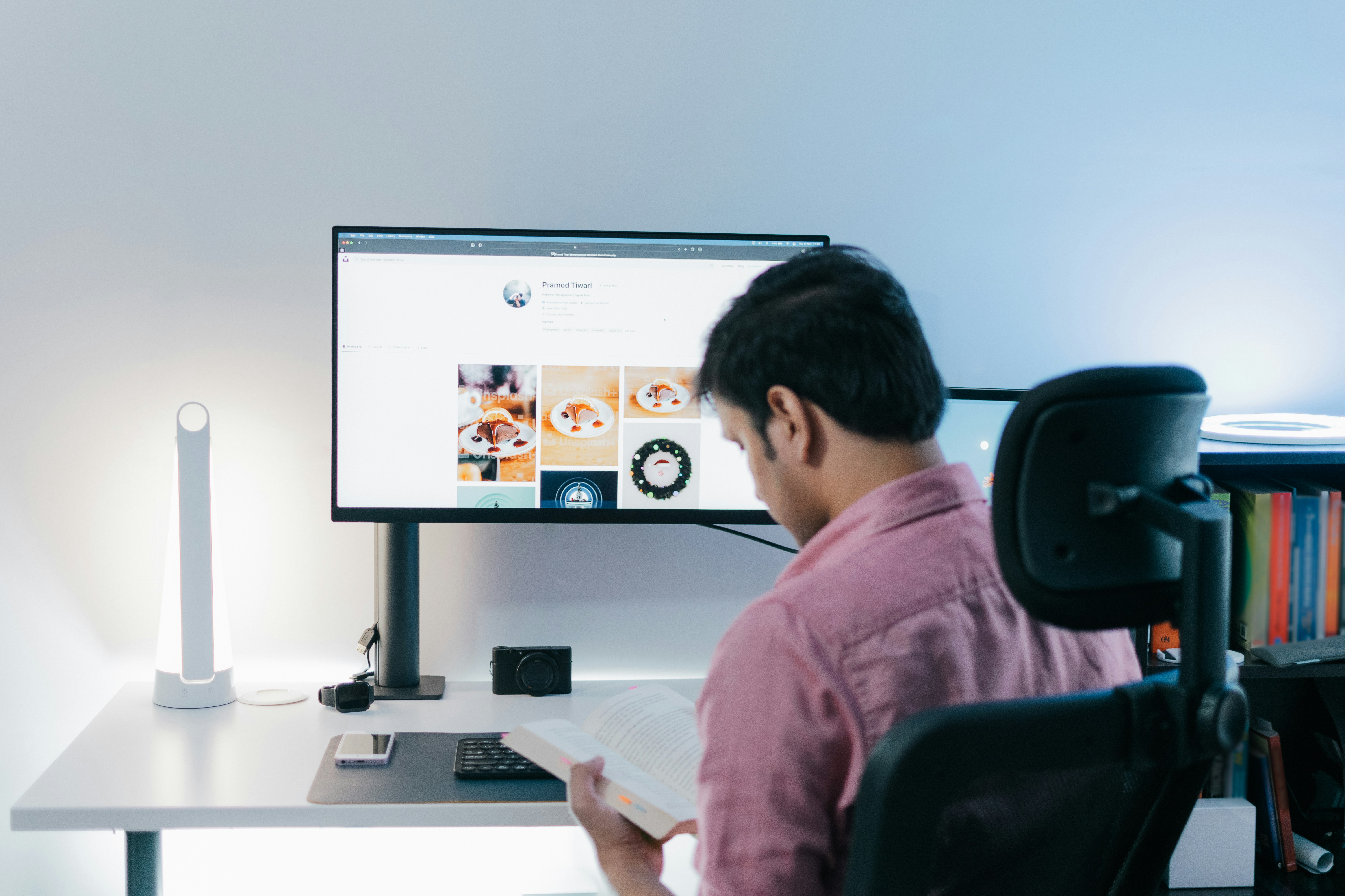 An image of a man reading a book